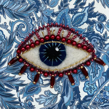 Beaded Brooch: Eye in Reds & Blues